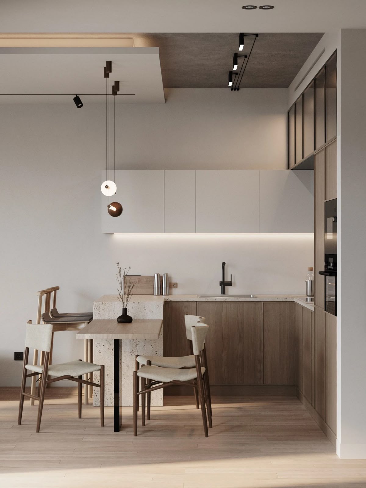 L型中島設計案例：小坪數機能型水磨石中島銜接輕巧木質餐桌，搭配俐落黑色軌道燈與內嵌式光源，在溫潤木質櫥櫃的襯托下，完美示範高坪效利用的現代公寓餐廚設計。
